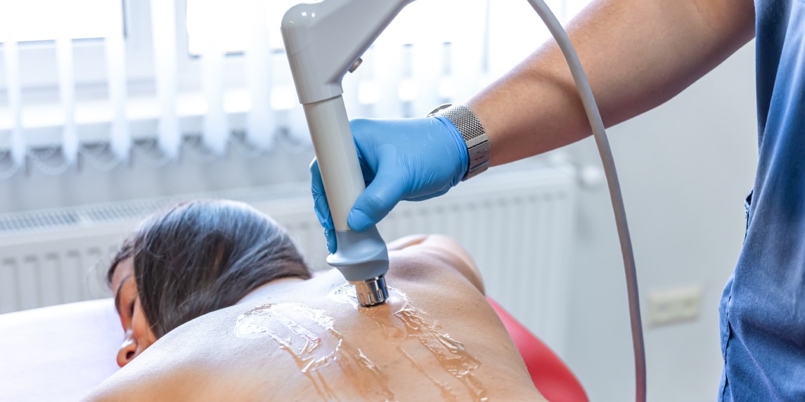 Extracorporeal shockwave therapy, physical therapy for neck and back muscles.