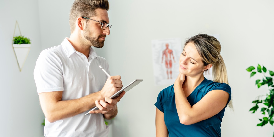 A Modern rehabilitation physiotherapy man at work with woman client